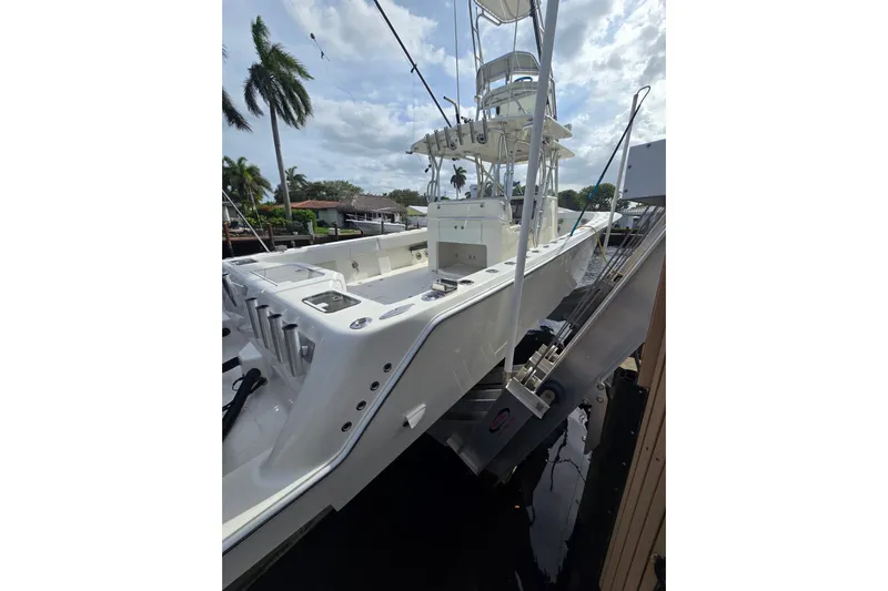 Yacht Photos Pics 2019 SeaVee 390Z boat docked, featuring sleek design and spacious deck.