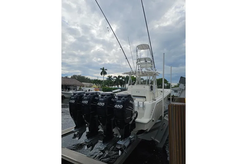  Yacht Photos Pics 2019 SeaVee 390Z boat with four powerful outboard motors docked under cloudy skies.