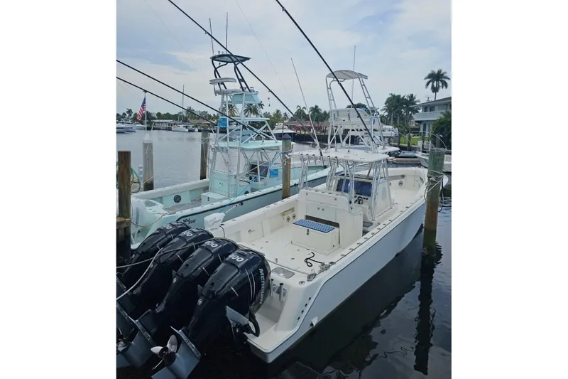 Yacht Photos Pics 2019 SeaVee 390Z boat docked with multiple outboard engines, ready for fishing.