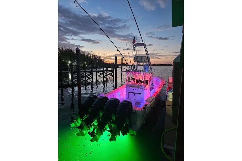  Yacht Photos Pics 2019 SeaVee 390Z boat with colorful lights docked at sunset.