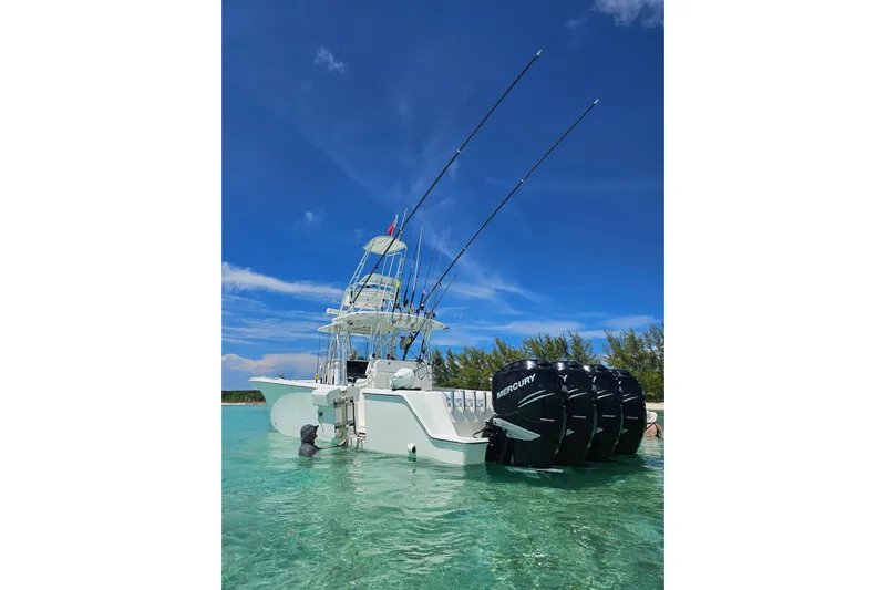  Yacht Photos Pics 2019 SeaVee 390Z boat with multiple Mercury engines in clear blue water.
