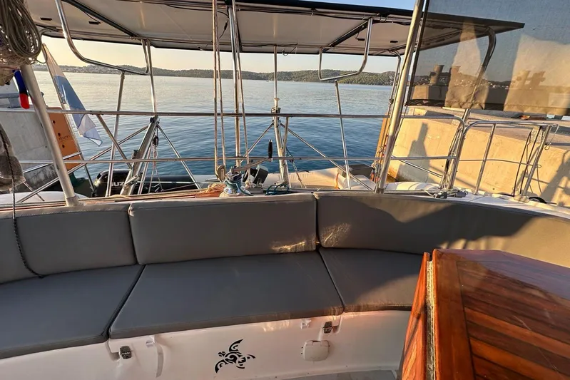  Yacht Photos Pics 1998 Fountaine Pajot Bahia 46 catamaran deck with seating, overlooking calm waters.