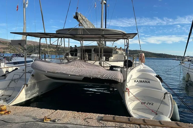  Yacht Photos Pics 1998 Fountaine Pajot Bahia 46 catamaran docked at a marina, with clear blue skies.