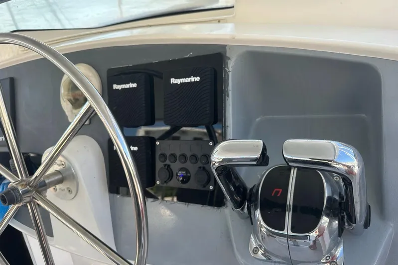  Yacht Photos Pics Steering wheel and controls of 1998 Fountaine Pajot Bahia 46 catamaran with Raymarine equipment.