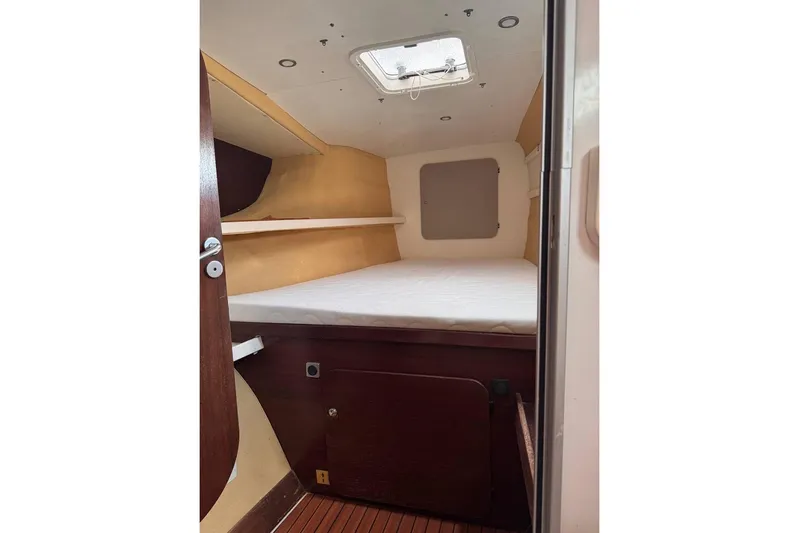  Yacht Photos Pics Cabin interior of 1998 Fountaine Pajot Bahia 46 catamaran with bed and storage.