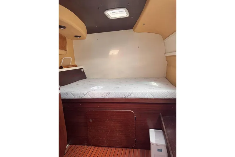  Yacht Photos Pics Cozy cabin interior of 1998 Fountaine Pajot Bahia 46 catamaran with wooden accents.