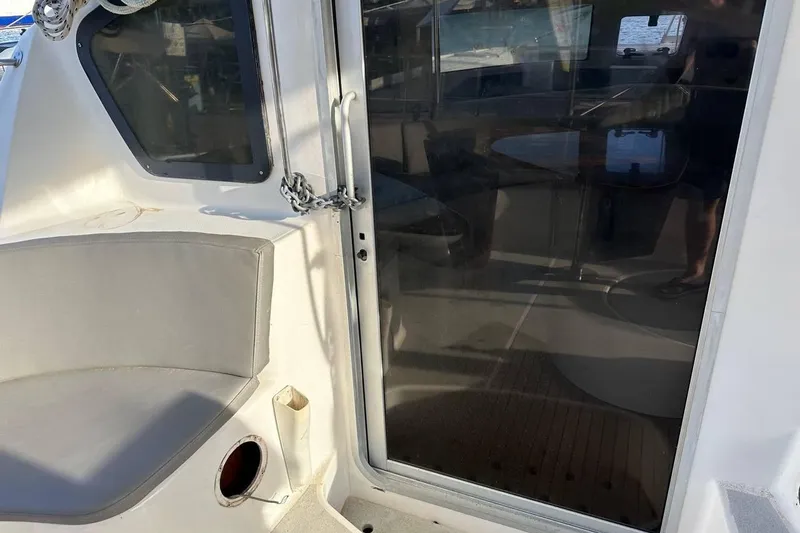  Yacht Photos Pics 1998 Fountaine Pajot Bahia 46 catamaran cockpit with seating and sliding door.