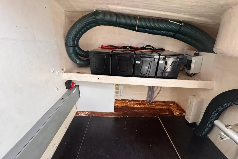  Yacht Photos Pics Battery compartment of a 1998 Fountaine Pajot Bahia 46 catamaran with ventilation hoses.