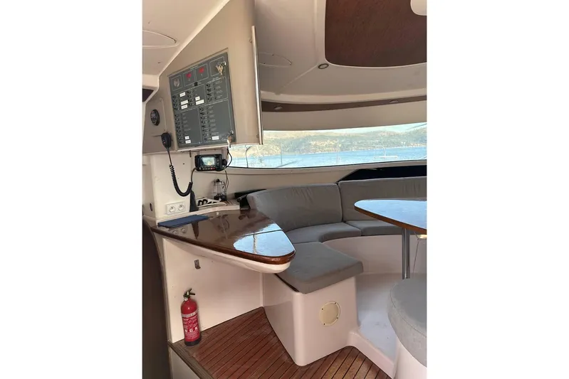  Yacht Photos Pics Interior of 1998 Fountaine Pajot Bahia 46 catamaran with seating and control panel.