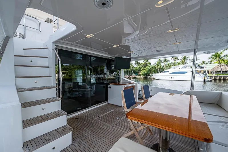Lucky 7 Yacht Photos Pics Luxurious 2017 Azimut 80 yacht deck with seating, table, and waterfront view.
