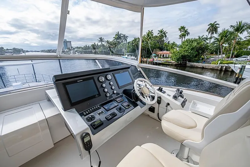 Lucky 7 Yacht Photos Pics Helm of 2017 Azimut 80 yacht with modern controls and scenic waterfront view.