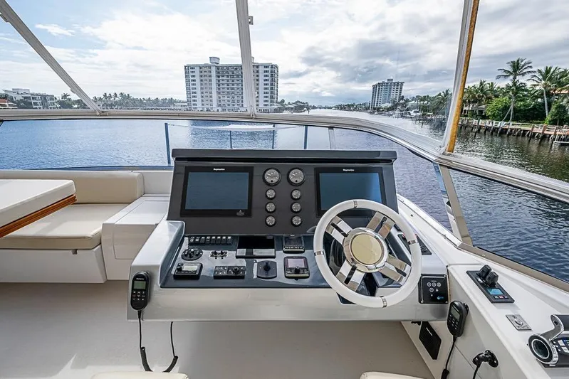 Lucky 7 Yacht Photos Pics Cockpit view of 2017 Azimut 80 yacht with modern navigation controls and waterfront scenery.