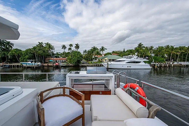 Lucky 7 Yacht Photos Pics Luxurious 2017 Azimut 80 yacht deck with scenic waterfront view and palm trees.