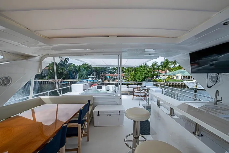 Lucky 7 Yacht Photos Pics Luxurious 2017 Azimut 80 yacht interior with seating, bar, and waterfront view.