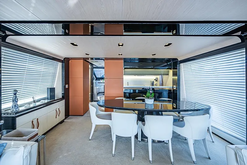 Lucky 7 Yacht Photos Pics Luxurious interior of 2017 Azimut 80 yacht with modern dining area and elegant furnishings.