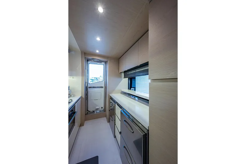 Lucky 7 Yacht Photos Pics Modern kitchen interior of 2017 Azimut 80 yacht with sleek cabinetry and stainless steel appliances.