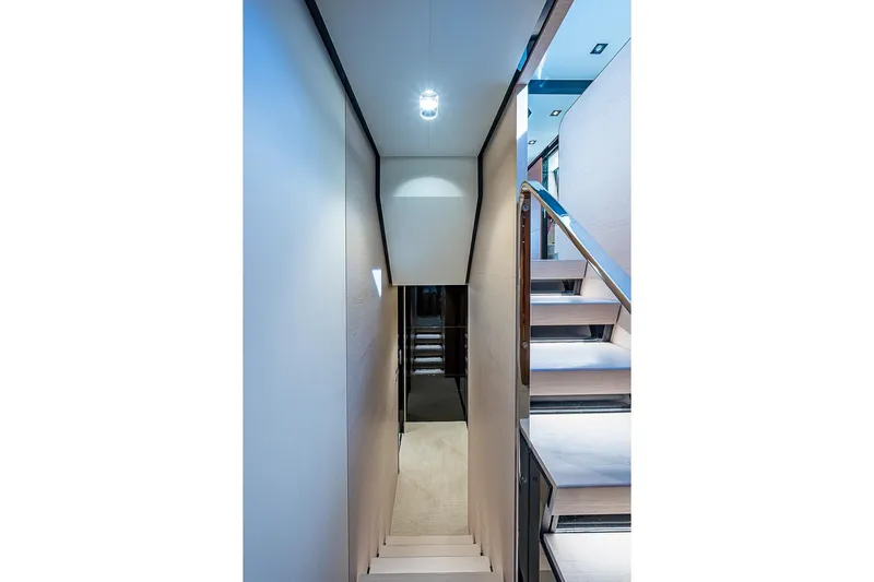 Lucky 7 Yacht Photos Pics Staircase interior of 2017 Azimut 80 yacht, featuring modern design and lighting.