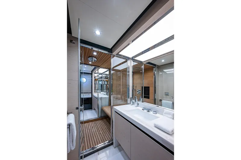 Lucky 7 Yacht Photos Pics Luxurious bathroom interior of 2017 Azimut 80 yacht with modern fixtures and wooden accents.