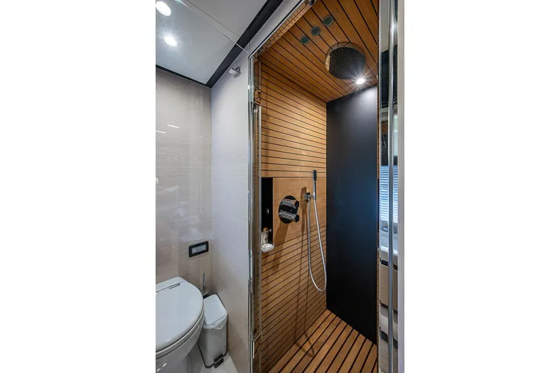 Lucky 7 Yacht Photos Pics Luxurious bathroom in 2017 Azimut 80 yacht with modern shower and wooden accents.
