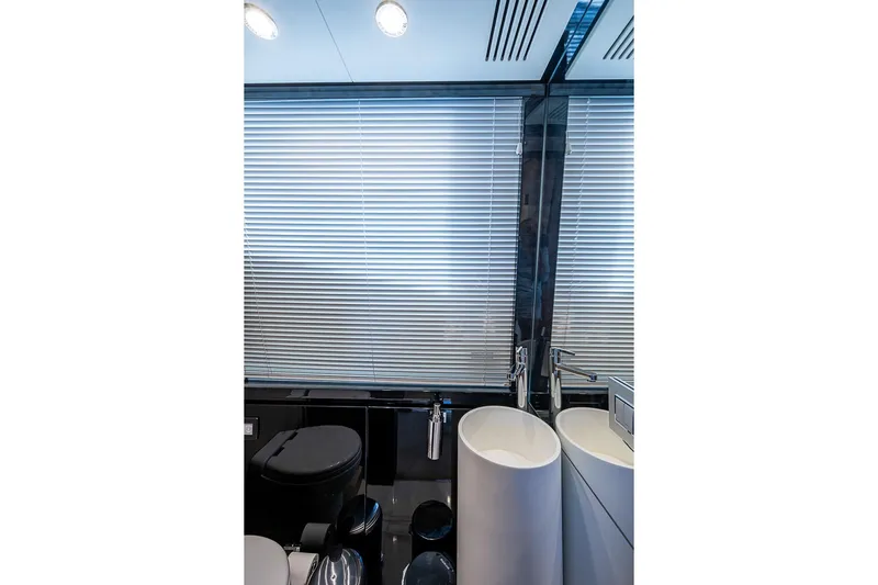 Lucky 7 Yacht Photos Pics Luxurious bathroom interior of 2017 Azimut 80 yacht with modern fixtures and blinds.