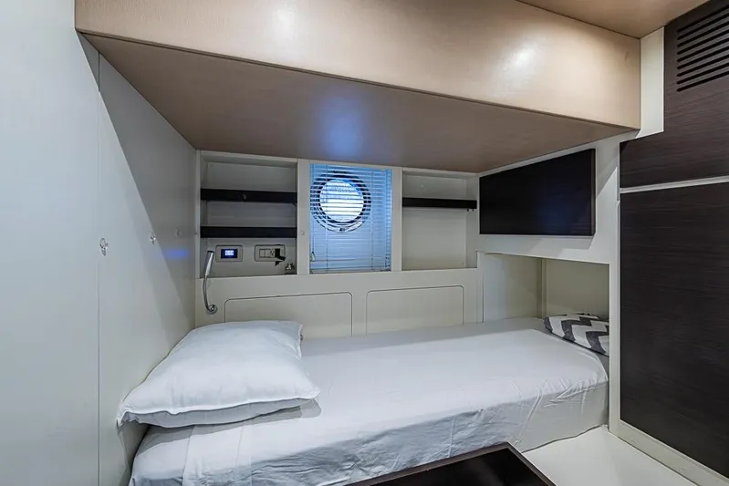 Lucky 7 Yacht Photos Pics 2017 Azimut 80 yacht cabin with single bed, porthole, and modern interior design.