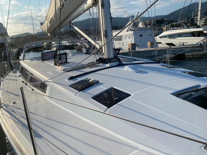  Yacht Photos Pics 2014 Beneteau Sense 50 sailboat docked in marina, showcasing sleek design and modern features.
