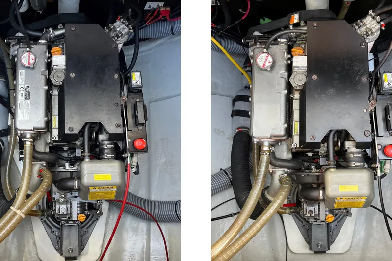  Yacht Photos Pics Engine compartment of a 2018 Lagoon 450S catamaran, showcasing mechanical components and hoses.