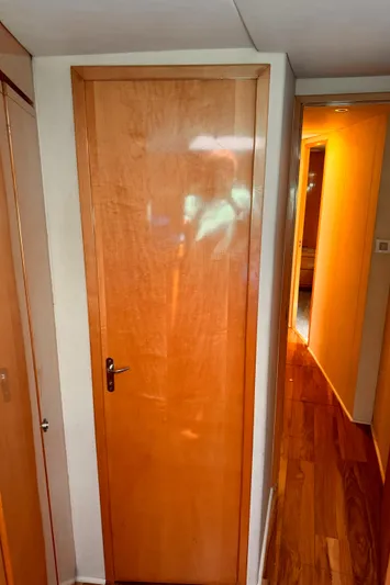 Satisfaction Yacht Photos Pics Wooden interior door on a 1999 Bertram 60 Convertible yacht.