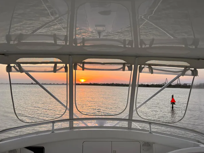 Satisfaction Yacht Photos Pics View from Bertram 60 Convertible yacht at sunset, 1999 model.