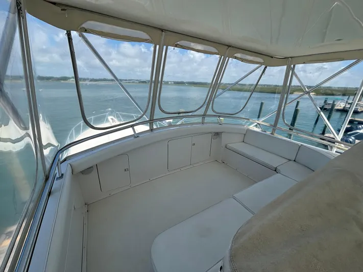 Satisfaction Yacht Photos Pics 1999 Bertram 60 Convertible yacht interior with panoramic ocean view.