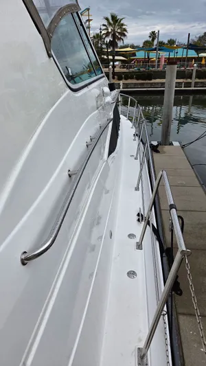 Always Friday Yacht Photos Pics Side view of 2000 Cruisers Yachts 4450 Express Motoryacht at dock.