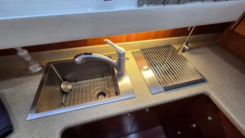 Always Friday Yacht Photos Pics Kitchen area of the 2000 Cruisers Yachts 4450 Express Motoryacht.