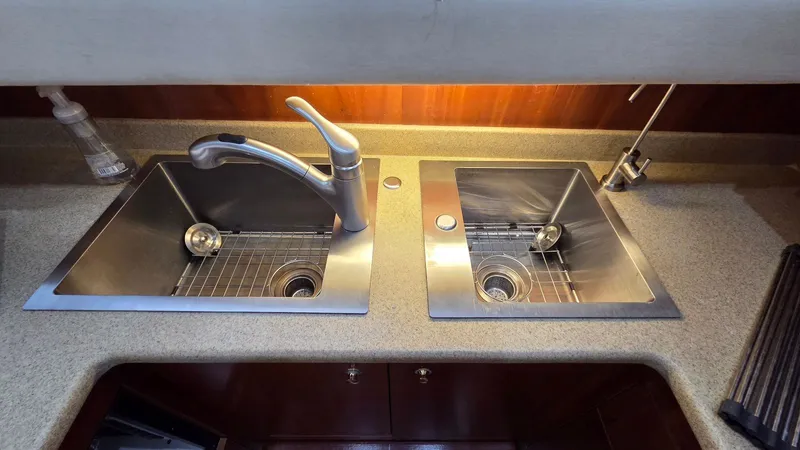 Always Friday Yacht Photos Pics Double stainless steel sink in a 2000 Cruisers Yachts 4450 Express Motoryacht.