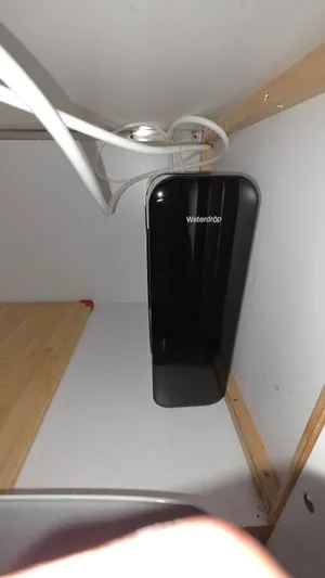 Always Friday Yacht Photos Pics Waterdrop filtration device installed in a cabinet.