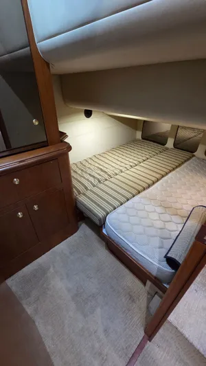 Always Friday Yacht Photos Pics Interior of 2000 Cruisers Yachts 4450 Express Motoryacht with cozy sleeping area.