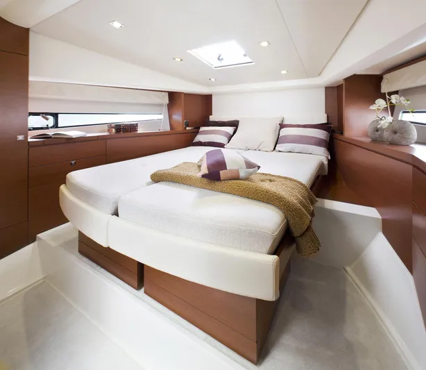 Ultima Risa Yacht Photos Pics Luxurious interior of 2016 Prestige 450 S yacht with cozy bed and elegant decor.