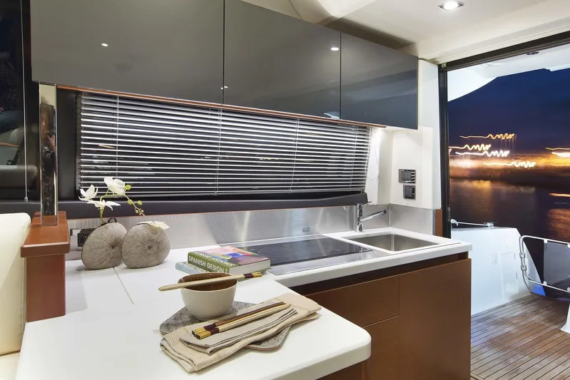 Ultima Risa Yacht Photos Pics Luxurious interior of 2016 Prestige 450 S yacht with modern kitchen and night view.