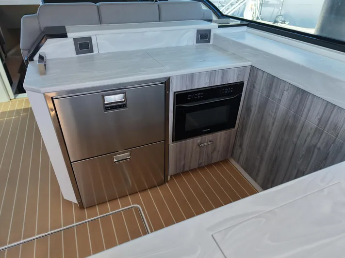 The Legacy Yacht Photos Pics 2022 Formula 500 SSC yacht kitchen with modern appliances and sleek design.