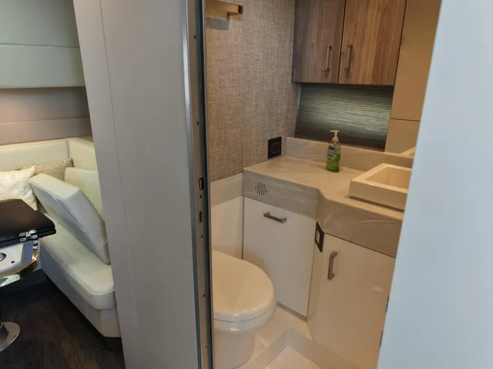 The Legacy Yacht Photos Pics Interior of 2022 Formula 500 SSC yacht featuring modern bathroom and seating area.