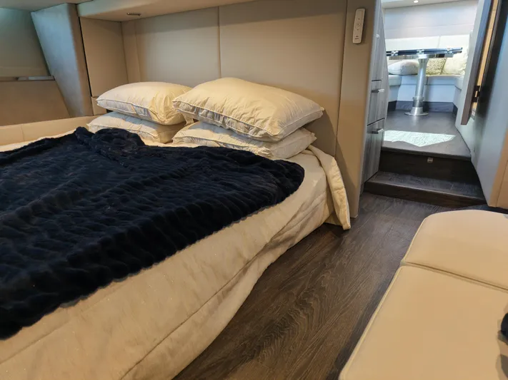 The Legacy Yacht Photos Pics 2022 Formula 500 SSC cabin interior with cozy bed and modern decor.