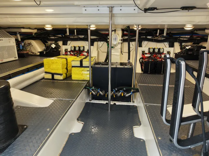 The Legacy Yacht Photos Pics 2022 Formula 500 SSC engine room with equipment and storage.