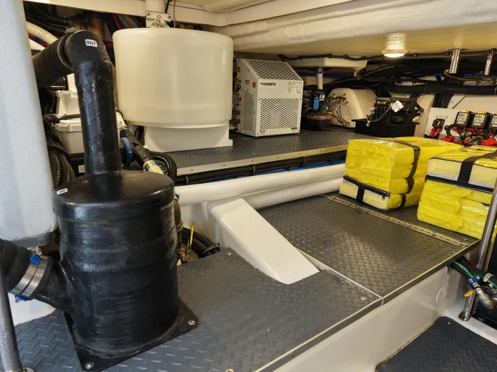 The Legacy Yacht Photos Pics 2022 Formula 500 SSC engine room with equipment and storage.