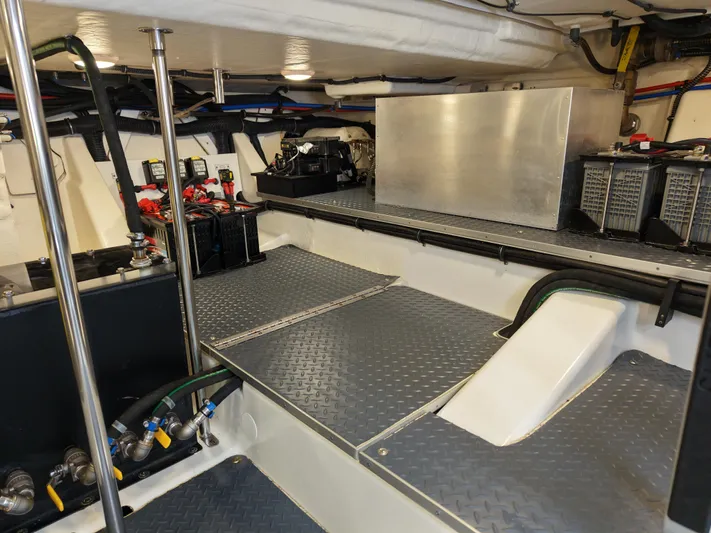 The Legacy Yacht Photos Pics 2022 Formula 500 SSC engine room with metal flooring and equipment.