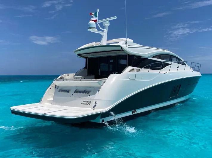 2018 Sea Ray L590 @ Cancun Yacht Photos Pics 2018 Sea Ray L590 yacht cruising on clear turquoise waters under a blue sky.