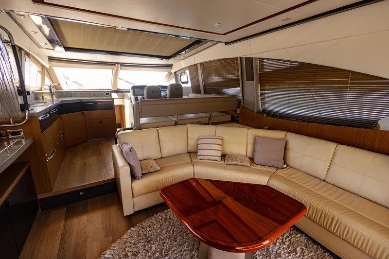 2018 Sea Ray L590 @ Cancun Yacht Photos Pics Luxurious interior of 2018 Sea Ray L590 yacht with plush seating and elegant wood finishes.