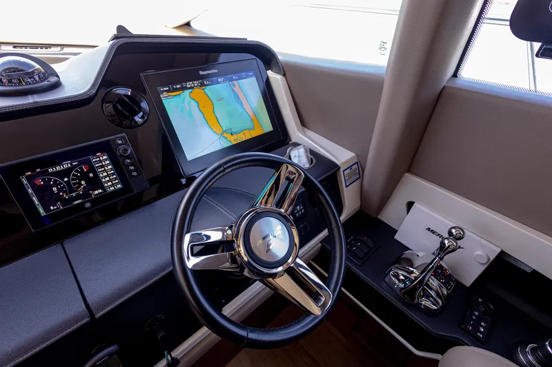 2018 Sea Ray L590 @ Cancun Yacht Photos Pics 2018 Sea Ray L590 helm with navigation screens and steering wheel.