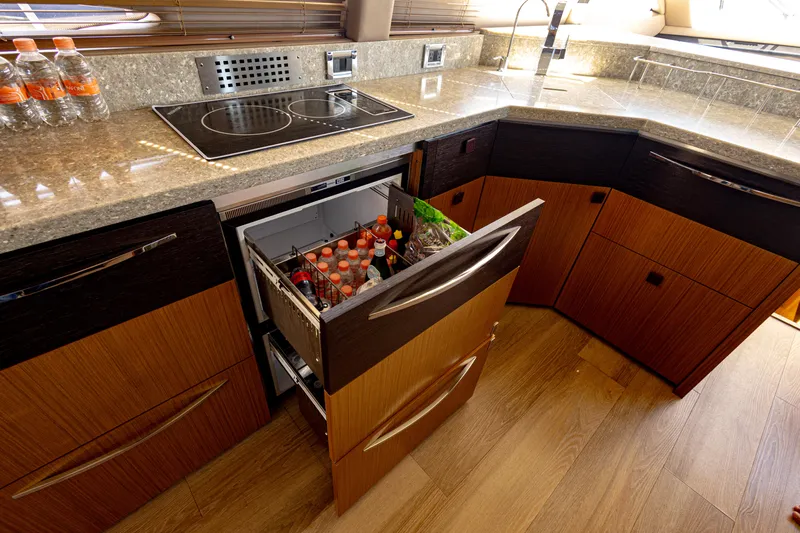 2018 Sea Ray L590 @ Cancun Yacht Photos Pics Luxurious 2018 Sea Ray L590 yacht kitchen with modern appliances and wooden cabinetry.