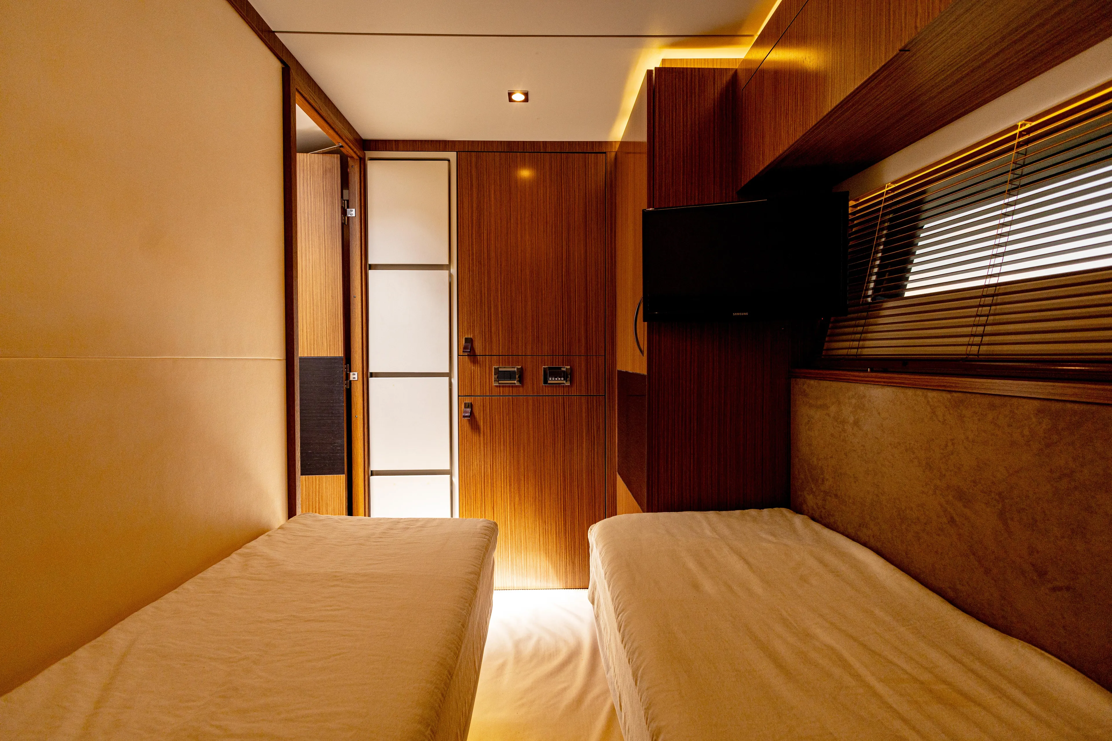 2018 Sea Ray L590 @ Cancun Yacht Photos Pics Luxurious cabin interior of 2018 Sea Ray L590 yacht with twin beds and TV.