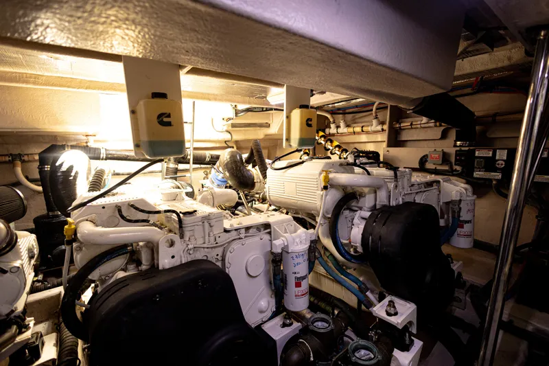 2018 Sea Ray L590 @ Cancun Yacht Photos Pics Engine room of 2018 Sea Ray L590 yacht, featuring dual engines and mechanical components.