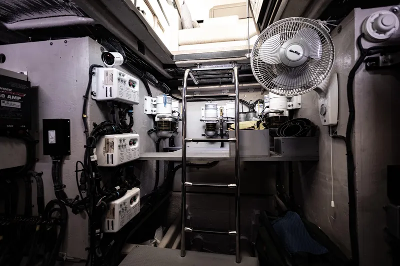 2018 Sea Ray L590 @ Cancun Yacht Photos Pics Engine room of 2018 Sea Ray L590 yacht with equipment and ladder.